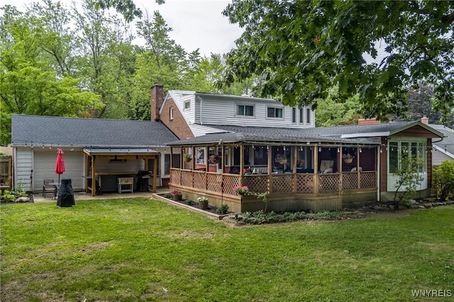 130 Hi View Ter, West Seneca, NY 14224 - back of property with a chimney, a hot tub, a lawn, and a sunroom