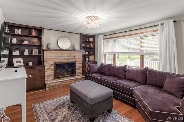 130 Hi View Ter, West Seneca, NY 14224 - living area featuring a brick fireplace and wood finished floors