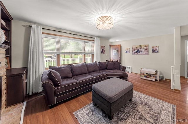 130 Hi View Ter, West Seneca, NY 14224 - living room featuring light wood finished floors and a brick fireplace
