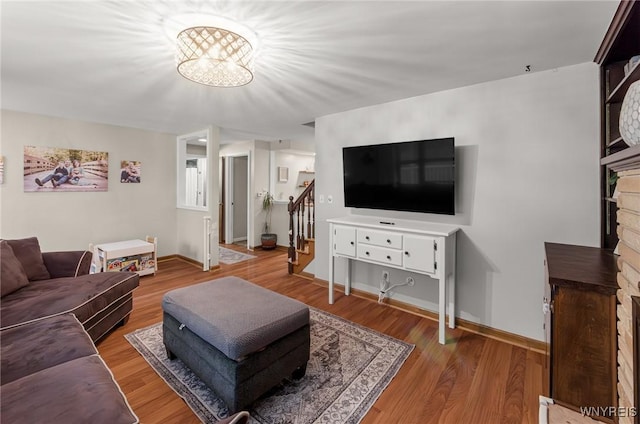 130 Hi View Ter, West Seneca, NY 14224 - living area featuring stairs, wood finished floors, and a chandelier
