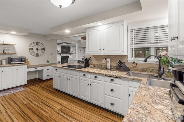 130 Hi View Ter, West Seneca, NY 14224 - kitchen featuring stainless steel microwave, black electric cooktop, white cabinetry, recessed lighting, and wood finished floors