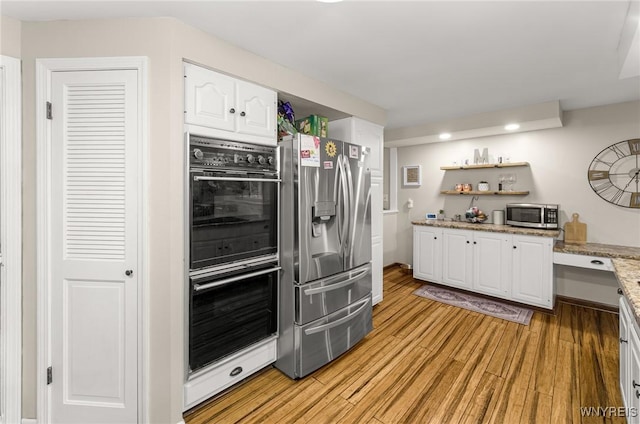 130 Hi View Ter, West Seneca, NY 14224 - kitchen featuring appliances with stainless steel finishes, white cabinets, light wood-style flooring, open shelves, and light stone countertops