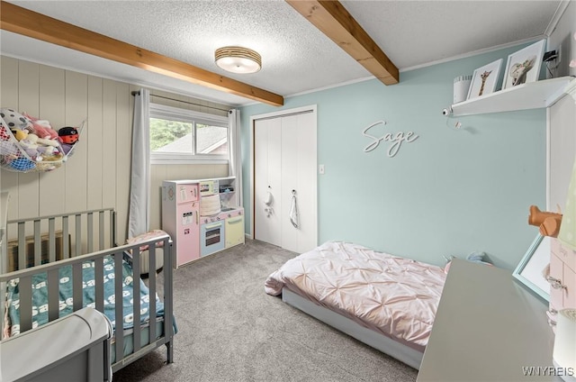 130 Hi View Ter, West Seneca, NY 14224 - bedroom featuring carpet floors, beamed ceiling, a closet, and a textured ceiling