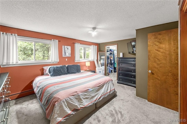130 Hi View Ter, West Seneca, NY 14224 - bedroom with carpet floors, a spacious closet, a textured ceiling, and ceiling fan