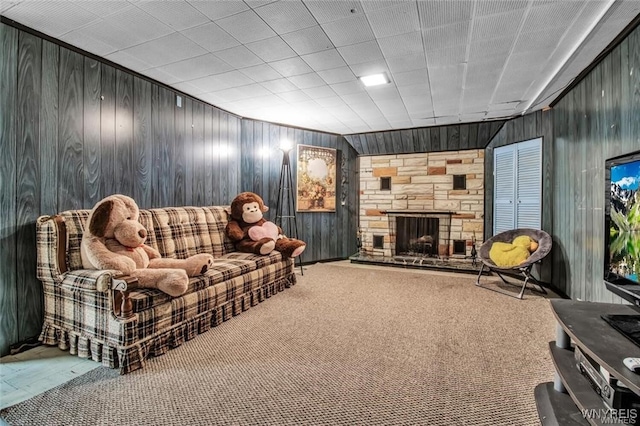 130 Hi View Ter, West Seneca, NY 14224 - living area with wooden walls, a fireplace, and carpet flooring