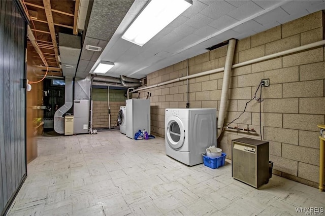 130 Hi View Ter, West Seneca, NY 14224 - unfinished basement with washing machine and dryer, tile patterned floors, heating unit, and concrete block wall