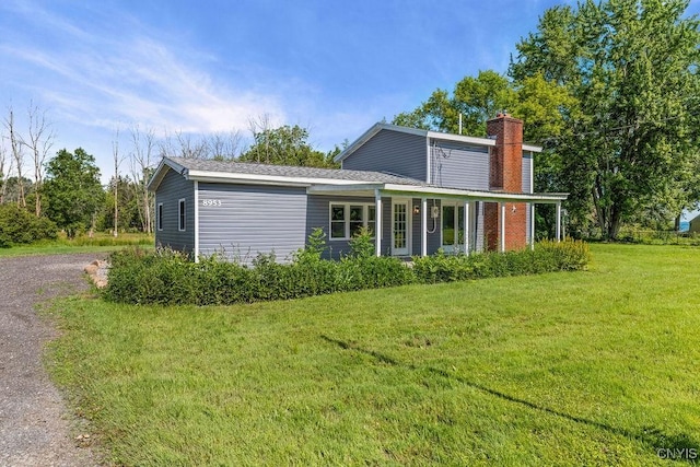 8953 Bushnell Shore Rd, Sullivan, NY 13037 - view of front of home featuring a chimney and a front yard