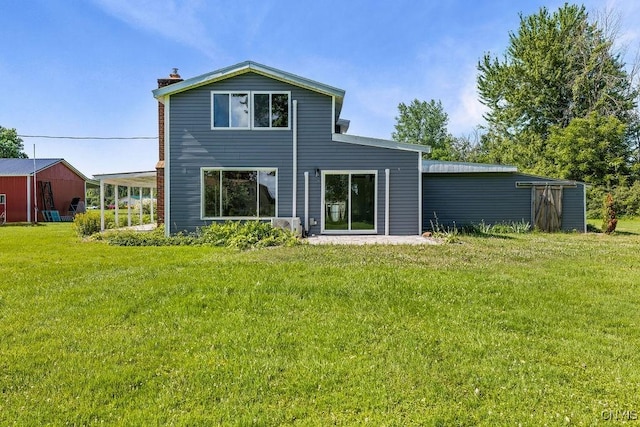 8953 Bushnell Shore Rd, Sullivan, NY 13037 - rear view of property featuring a lawn and a chimney