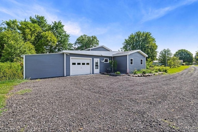 8953 Bushnell Shore Rd, Sullivan, NY 13037 - view of front facade featuring a garage and gravel driveway