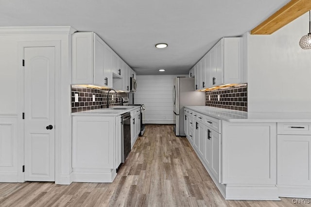 8953 Bushnell Shore Rd, Sullivan, NY 13037 - kitchen featuring light countertops, backsplash, stainless steel appliances, white cabinets, and recessed lighting