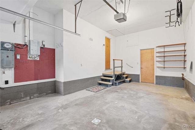 178 Wainwright Ave, Syracuse, NY 13208 - garage with a garage door opener and electric panel