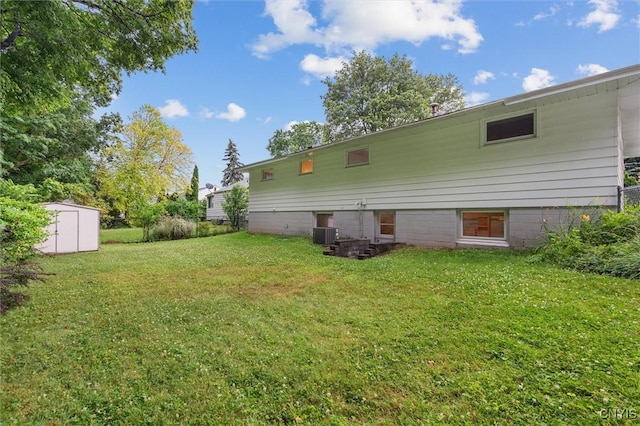 178 Wainwright Ave, Syracuse, NY 13208 - rear view of house with a storage shed and a lawn