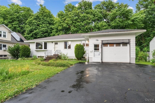 178 Wainwright Ave, Syracuse, NY 13208 - view of front facade with asphalt driveway and an attached garage