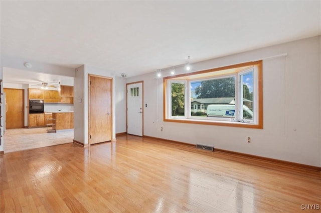 178 Wainwright Ave, Syracuse, NY 13208 - unfurnished living room featuring light wood-type flooring