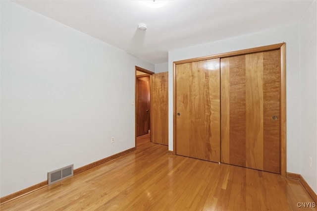 178 Wainwright Ave, Syracuse, NY 13208 - unfurnished bedroom with light wood-style floors and a closet