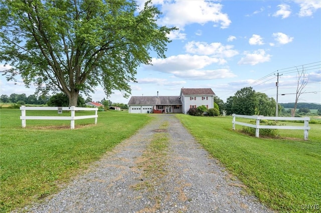 6767 Stauber Rd, Summerhill, NY 13073 - view of front of property with driveway, a front lawn, and a garage