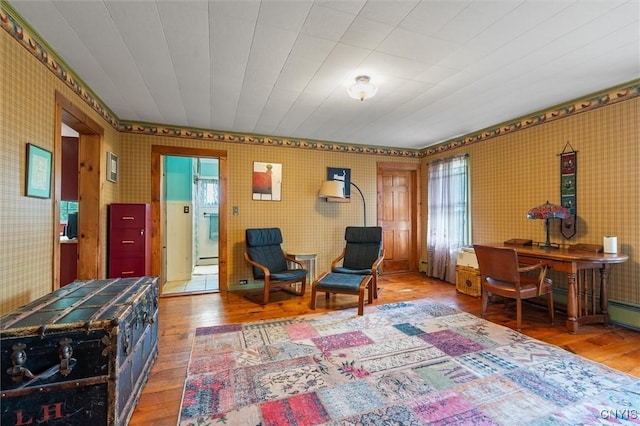 6767 Stauber Rd, Summerhill, NY 13073 - sitting room with hardwood / wood-style floors, wallpapered walls, plenty of natural light, and a baseboard heating unit