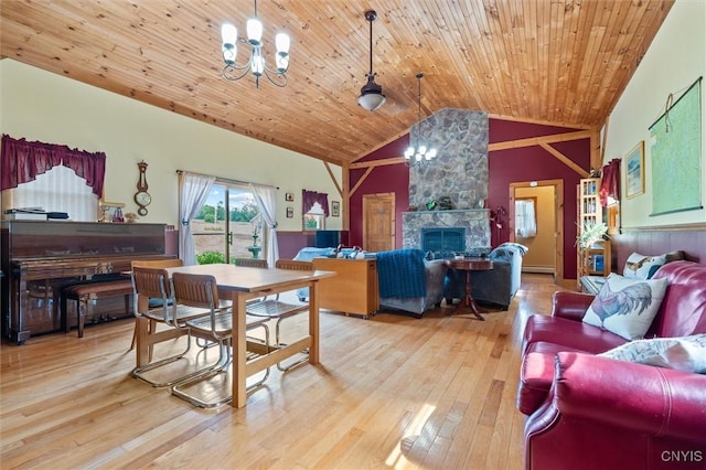 6767 Stauber Rd, Summerhill, NY 13073 - dining room with a chandelier, vaulted ceiling, wood finished floors, a fireplace, and wooden ceiling