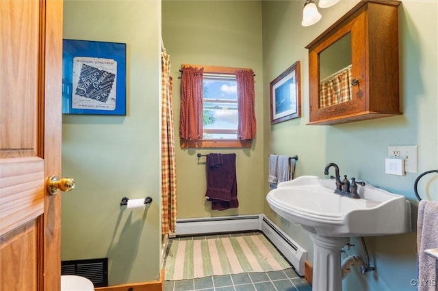 6767 Stauber Rd, Summerhill, NY 13073 - bathroom featuring baseboard heating