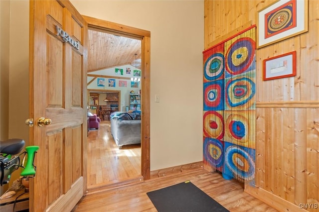 6767 Stauber Rd, Summerhill, NY 13073 - hallway with wood finished floors, lofted ceiling, wood walls, and wood ceiling