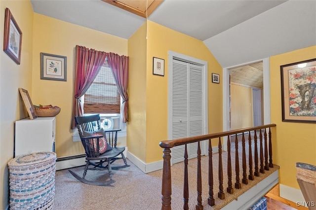 6767 Stauber Rd, Summerhill, NY 13073 - sitting room with vaulted ceiling, attic access, carpet, and a baseboard heating unit