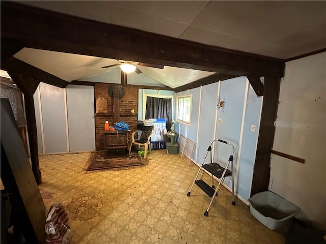 135 William St, Palmyra, NY 14522 - basement with a wood stove, tile patterned floors, and ceiling fan