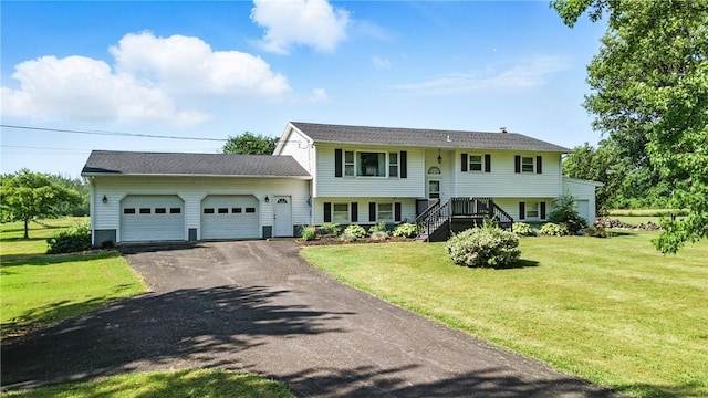 1292 Gassner Rd, Junius, NY 13165 - raised ranch with an attached garage, asphalt driveway, a front yard, and stairs