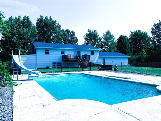 1292 Gassner Rd, Junius, NY 13165 - view of swimming pool with a water slide, stairway, a deck, a patio, and view of scattered trees
