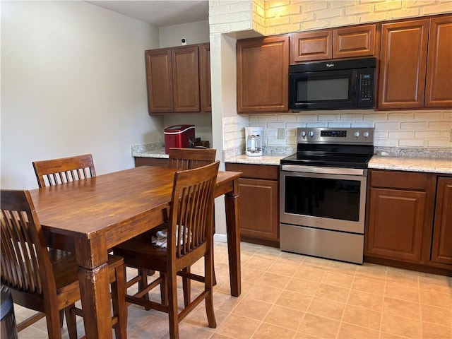 1292 Gassner Rd, Junius, NY 13165 - kitchen featuring black microwave, stainless steel range with electric cooktop, and tasteful backsplash