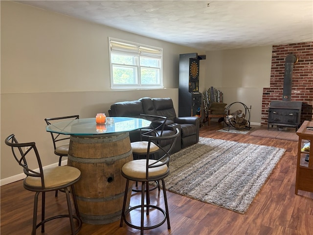 1292 Gassner Rd, Junius, NY 13165 - dining space featuring wood finished floors, a wood stove, and a textured ceiling