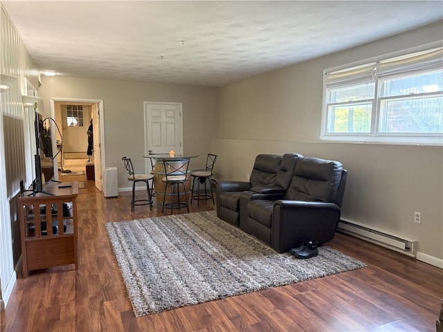 1292 Gassner Rd, Junius, NY 13165 - living room with a baseboard heating unit and dark wood finished floors