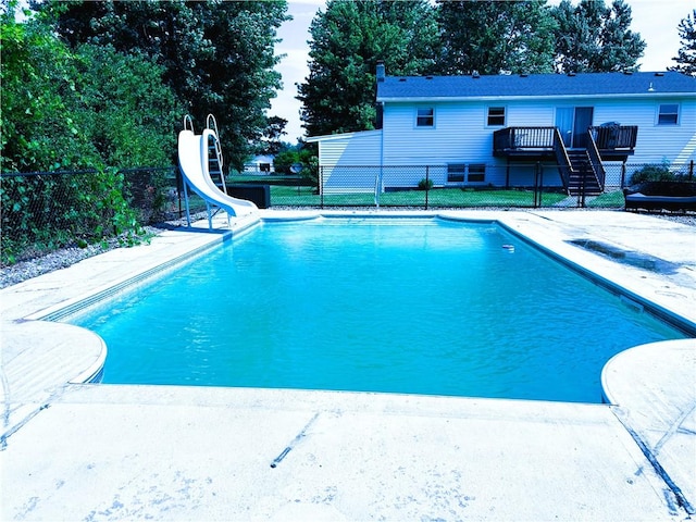 1292 Gassner Rd, Junius, NY 13165 - view of swimming pool featuring a water slide, stairs, a deck, and a patio area