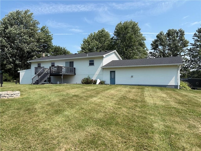 1292 Gassner Rd, Junius, NY 13165 - back of property with a wooden deck, a lawn, and stairway