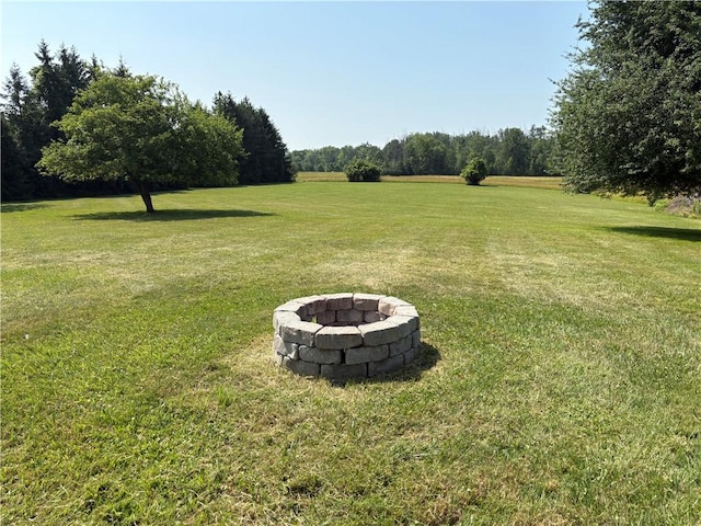 1292 Gassner Rd, Junius, NY 13165 - view of green lawn featuring an outdoor fire pit