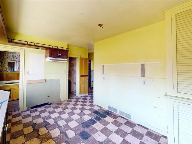 11139 S Lake Rd, Pavilion, NY 14525 - kitchen with tile patterned floors and under cabinet range hood