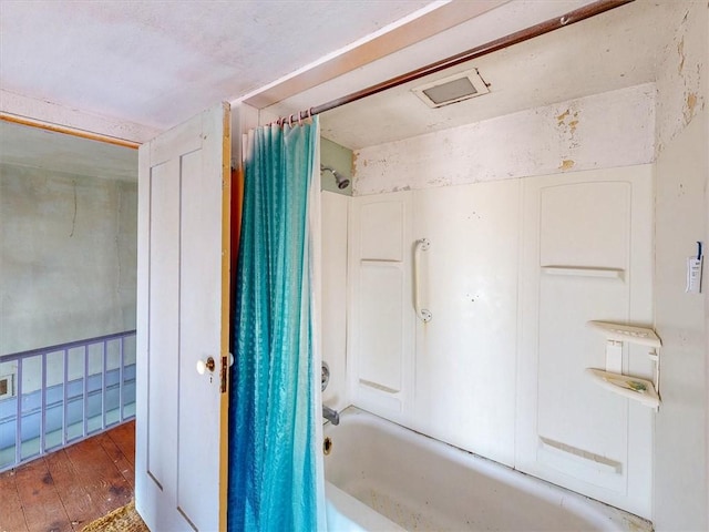 11139 S Lake Rd, Pavilion, NY 14525 - full bathroom with shower / bath combo with shower curtain and wood-type flooring