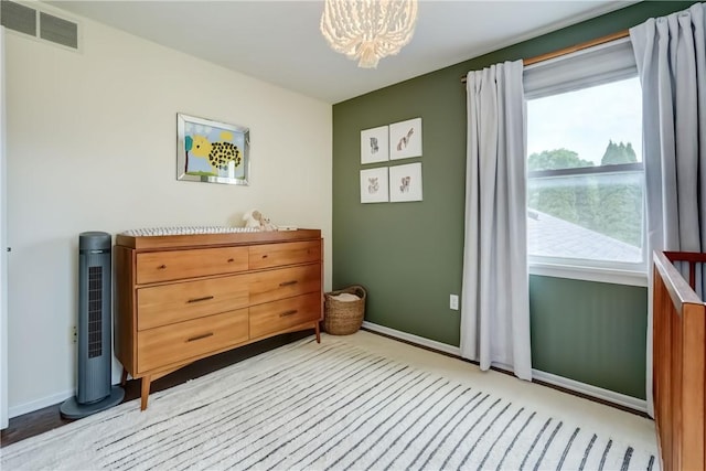 1125 Shoecraft Rd, Webster, NY 14580 - bedroom featuring a chandelier and baseboards