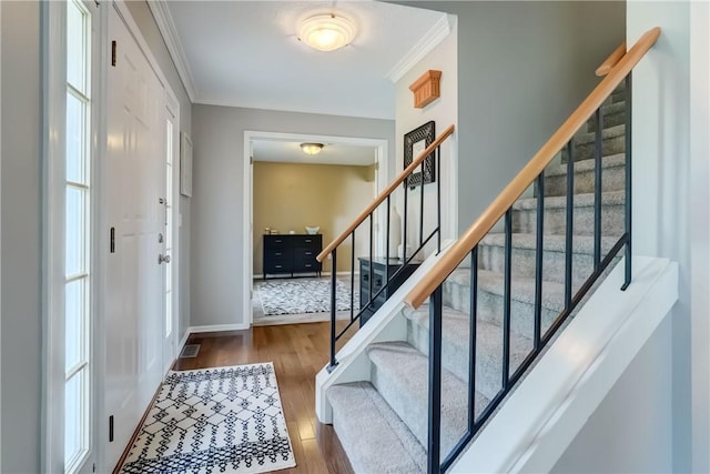 1125 Shoecraft Rd, Webster, NY 14580 - foyer entrance featuring crown molding, wood finished floors, and stairs