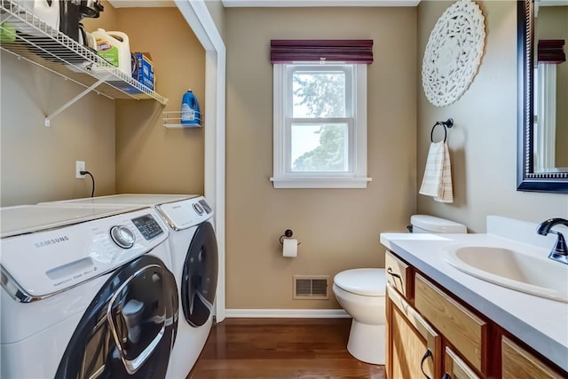1125 Shoecraft Rd, Webster, NY 14580 - laundry room featuring washing machine and dryer and dark wood-style flooring