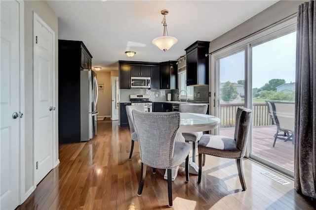 1125 Shoecraft Rd, Webster, NY 14580 - dining room with hardwood / wood-style floors