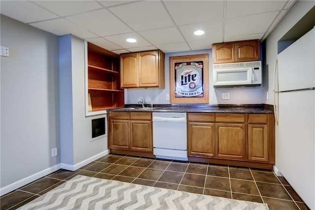 1125 Shoecraft Rd, Webster, NY 14580 - kitchen with white appliances, dark countertops, dark tile patterned flooring, open shelves, and a paneled ceiling