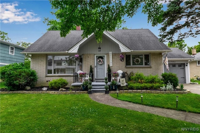 204 French Lea Rd, West Seneca, NY 14224 - view of front of property featuring an attached garage, brick siding, and a front lawn