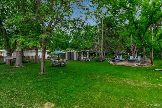 204 French Lea Rd, West Seneca, NY 14224 - view of yard featuring a storage unit, an outdoor fire pit, and a patio area