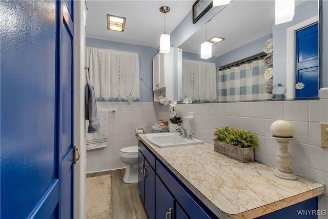 204 French Lea Rd, West Seneca, NY 14224 - full bath with vanity, tile walls, and wood finished floors