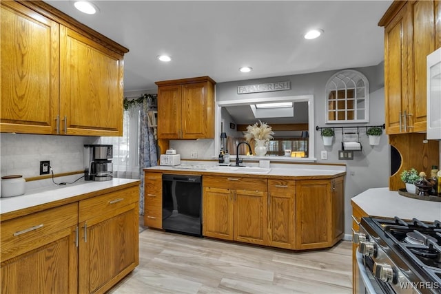 204 French Lea Rd, West Seneca, NY 14224 - kitchen featuring black dishwasher, brown cabinets, light countertops, backsplash, and recessed lighting
