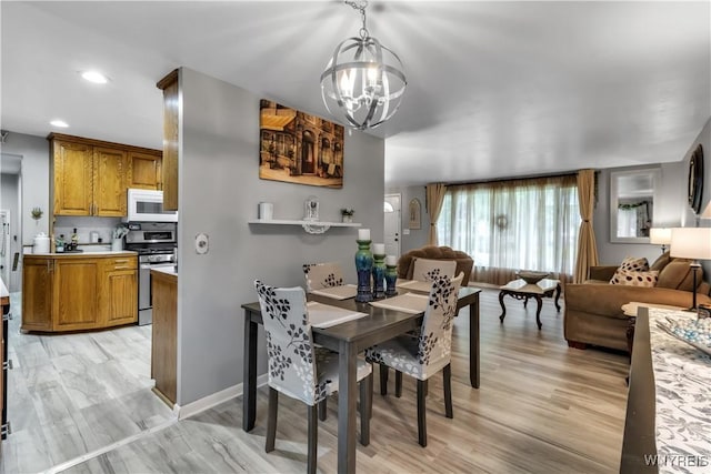 204 French Lea Rd, West Seneca, NY 14224 - dining area with a chandelier, light wood finished floors, and recessed lighting