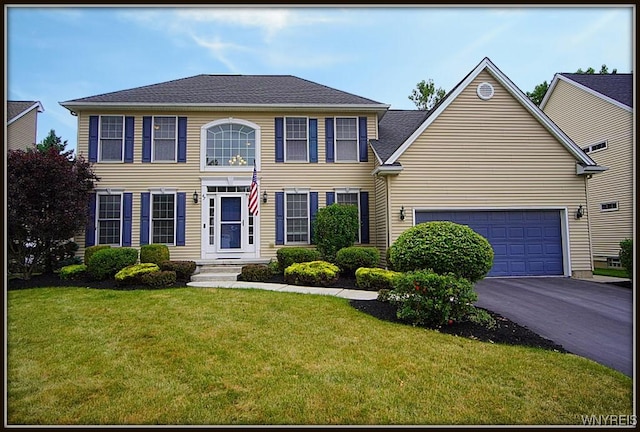 47 Timber Cove Ct, Amherst, NY 14051 - colonial home featuring driveway, a front yard, and an attached garage