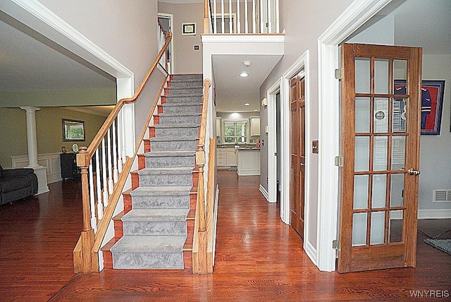 47 Timber Cove Ct, Amherst, NY 14051 - stairway featuring wood finished floors and decorative columns