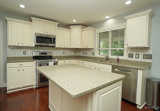 47 Timber Cove Ct, Amherst, NY 14051 - kitchen featuring stainless steel appliances, dark wood finished floors, decorative backsplash, light stone countertops, and recessed lighting