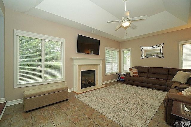 47 Timber Cove Ct, Amherst, NY 14051 - living area featuring ceiling fan, healthy amount of natural light, a tile fireplace, and a raised ceiling